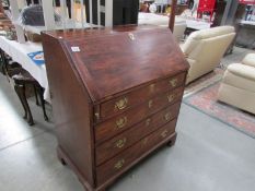 A mahogany bureau.