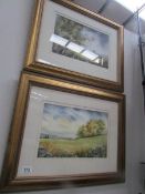 A pair of framed and glazed rural scenes.