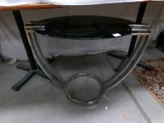 An art deco style glass topped table.