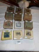 12 boxed set of magic lantern slides being Natural History, Swiss Family Robinson, Handy Andy,