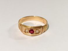 A ruby and pearl set ring in 18ct gold, dated Birmingham 1890, size L.