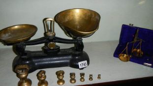 A set of Libra kitchen scales and a set of brass gold scales.