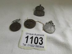 A silver ARP badge, an 1894 S Africa one shilling,