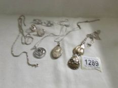 A mixed lot of vintage silver jewellery including pendants, chains, earrings etc.