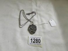 A vintage paste set pendant on silver chain.