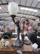 A figural table lamp and a 'Lily' table lamp.