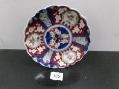 An Imari plate.