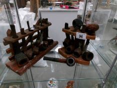 11 pipes (including Dr. Plumb, K & P Peterson's), 2 pipe bowls and 2 pipe racks.