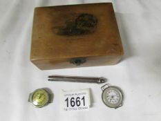 A Mauchlin ware box containing a silver propelling pencil and 2 wrist watch heads.