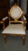 A gilded salon chair,.