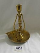 A 19th century brass ships gimble candle holder.
