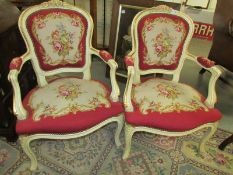 A pair of salon chairs with tapestry seats and backs.