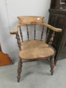 An oak captain's chair.