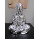 A silver coloured Buddha,