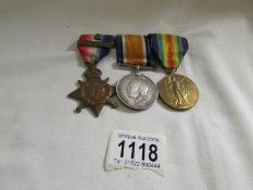 A 1914 star with clasp, A WW1 British war medal and Victory medal for Pte. W Dowman, I/Lincs.