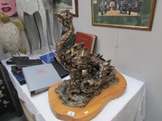 An interesting hand formed ceramic dragon,