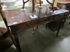 A 3 drawer mahogany table.