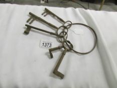 A collection of old keys on metal ring,