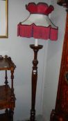 A mahogany standard lamp with shade,