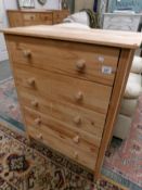 A pine 5 drawer chest.