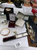 A mixed lot of costume jewellery including watches, brooches, necklaces, earrings etc.