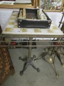 A telescopic chess table with cast iron base, brass column,