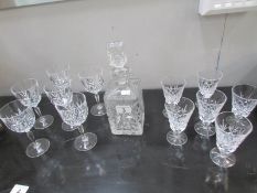 A cut glass decanter and 2 sets of 6 cut glass wine glasses,