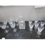 A cut glass decanter and 2 sets of 6 cut glass wine glasses,