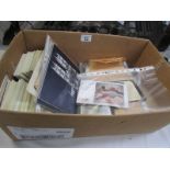 A box of assorted stamps including block sheets, loose and on envelopes.