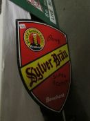 A Silver Brau advertising sign,