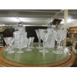2 cut glass decanters and glasses.