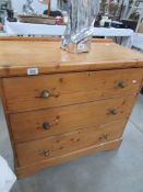 A 3 drawer pine chest.