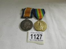 A WW1 war medal and victory medal for Pte. J E Buckingham, Queens Regiment.