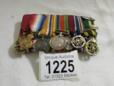 A set of 9 miniature medals with bar and ribbons,