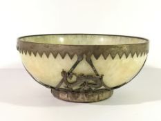 A jade bowl with white metal decoration, signed.