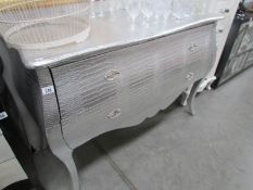 A silver coloured 2 drawer chest