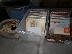 2 boxes of LP records and a bag of 45 rpm records.