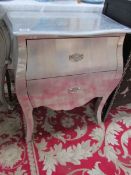 A silver coloured 3 drawer chest.