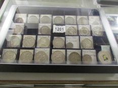 A collection tray of 19th century French, Spanish and South American mostly silver coins.