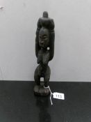 A West African female ancestor/fertility figure statue from Cote D'Ivoire.