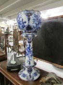 A blue and white jardiniere and stand,.