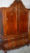 A superb quality 1950's walnut cabinet on drawer base.