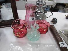A contemporary cranberry glass milk jug and sugar basin, an etched vase and a small art glass vase.