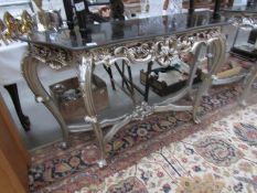 A silver coloured console table,