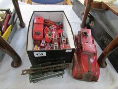 A quantity of unboxed die cast and tin plate fire engines including Dinky