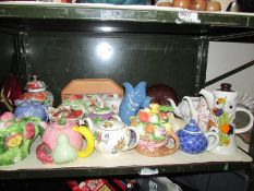 A shelf of assorted teapots