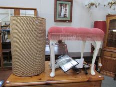 A dressing table stool and a linen bin