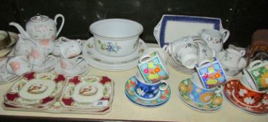 A shelf of assorted tea ware