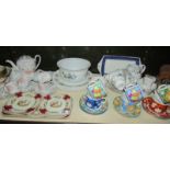 A shelf of assorted tea ware
