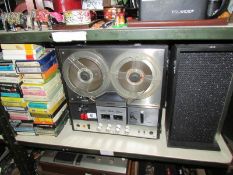 A reel to reel tape records,